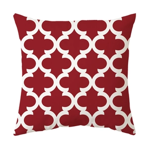 Macro shot of Nordic geometric interlocking clover pattern on burgundy cushion cover
