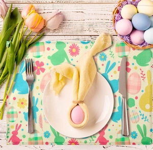 Close-up of Easter placemat with colorful bunny prints on a white rustic wooden table