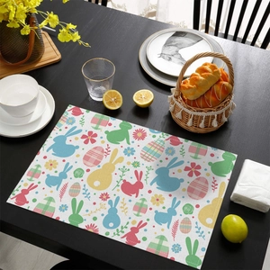 Easter bunny and colorful eggs table mat on dark wood table for holiday dining decor