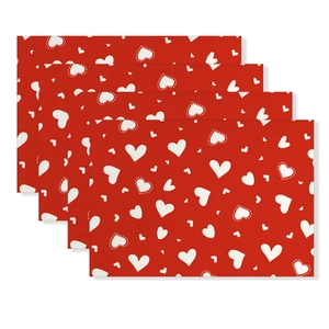 Four-piece set of red Valentine's placemats with white heart patterns on white background