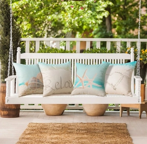 Set of 4 waterproof linen pillow covers featuring starfish and seashell designs on a swing