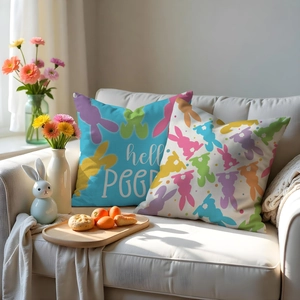 Detailed view of Easter linen pillowcases featuring colorful rabbit prints and hello PEEP text