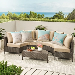 Waterproof outdoor rattan sofa set with starfish seashell linen pillows and ocean view