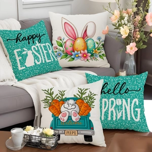 Detail of four Easter pillow covers with rabbit and egg patterns on a grey sofa