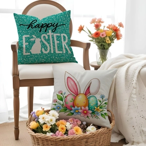 Detail of Easter cotton linen pillow covers with bunny and egg prints on a wooden chair