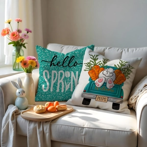 Detailed view of two Easter throw pillows with spring motifs on a white sofa decor