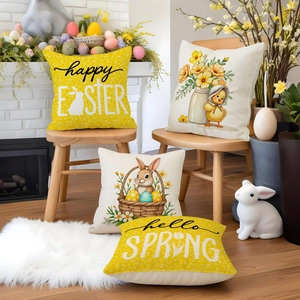 Close-up of set of four Easter linen pillow covers with happy Easter and rabbit prints