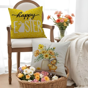 Close-up of Easter linen cushion covers with rabbit print and floral chicken illustration