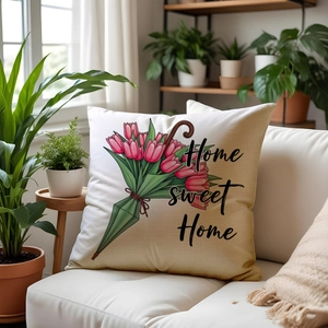 Detailed close-up of floral pillow with pink tulips and Home Sweet Home text on fabric
