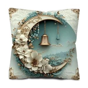 Detail view of moon and floral relief pillowcase with hanging bell and gold corners