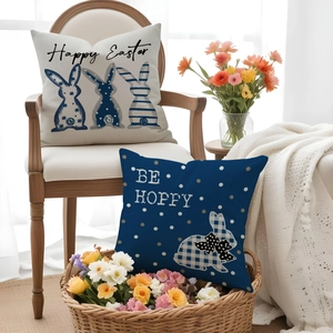 Close-up of linen-textured Easter pillow covers featuring Happy Easter bunny prints