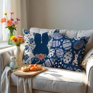 Detailed view of Easter rabbit and egg pattern pillow covers on a white sofa