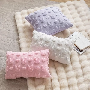 Easter bunny embroidered plush pillow covers in pink, white, and purple colors
