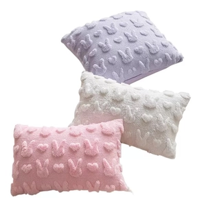 Easter bunny embroidered plush pillow covers in purple, white, and pink tones