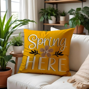 Detailed texture of yellow canvas cushion cover featuring Spring IS HERE printed design