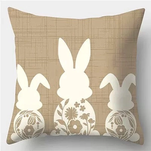 Easter linen pillow cover featuring white rabbit silhouettes with floral accents on beige