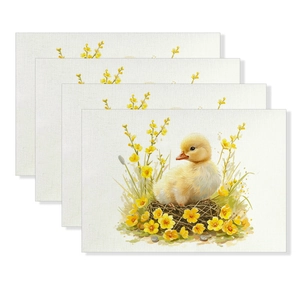 Detail view of four linen placemats featuring Easter ducklings and yellow floral patterns