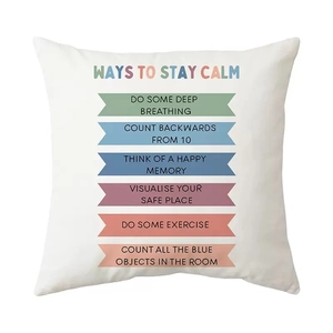 Detail of square white cushion cover with Ways to Stay Calm mental health text