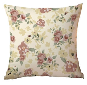 Détail d'un motif floral vintage avec des roses roses sur une housse de coussin beige