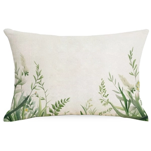 Dettaglio della trama in lino e della stampa floreale verde sulla federa decorativa