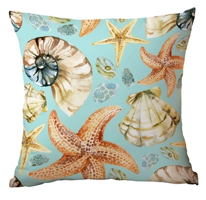 Macro shot of seashell and starfish watercolor print on blue ocean themed cushion cover
