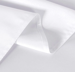 Detailed macro view of white textile fabric with high-density weave and neat lockstitch edges