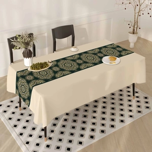 Ethnic bohemian table runner with green mandala pattern on long rectangular dining table