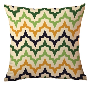 Close-up of geometric zigzag pattern on square pillowcase with green and orange tones