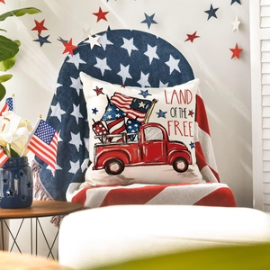 Close-up of Independence Day linen pillowcase with red truck and Land of the Free text