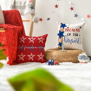 Detail of linen pillow covers with Independence Day star prints and patriotic slogans