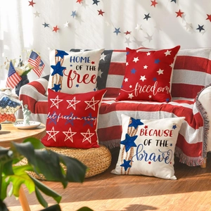 Detail of four linen Independence Day pillow covers with stars and patriotic quotes