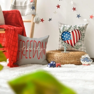 Close-up of patriotic Independence Day pillow covers with Freedom and US flag heart design