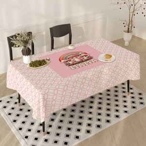 Detail of a Mother's Day tablecloth featuring pink MAMA floral design and rainbow patterns