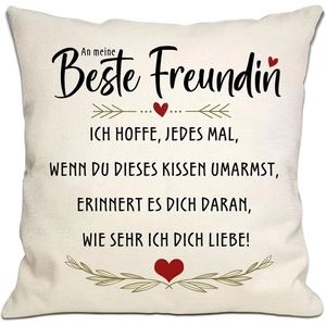 Close-up detail of linen pillowcase with German text and red heart floral patterns