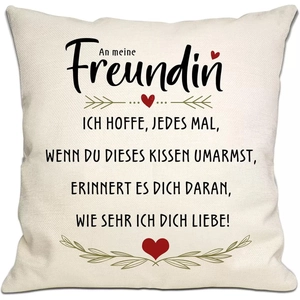 Close-up of linen pillowcase with German text and red heart decoration detail