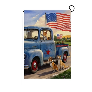 Detail of vintage blue pickup truck garden flag with dogs and American flag design