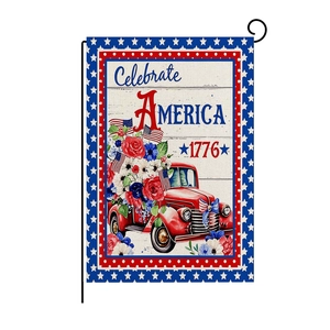 Detail of vintage USA garden flag featuring a red truck with flowers and 1776 lettering