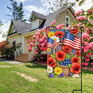 Patriotic garden flag featuring flower basket and American flags in a sunny yard