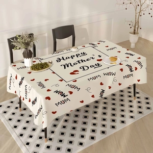 Floral Happy Mother's Day tablecloth with red hearts on a wooden dining table