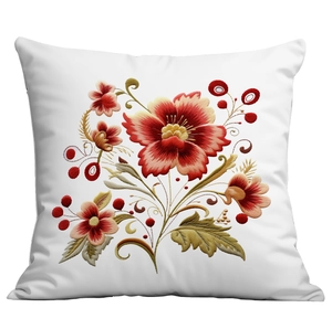 Close-up of floral embroidery on a white pillowcase featuring red flowers and green leaves