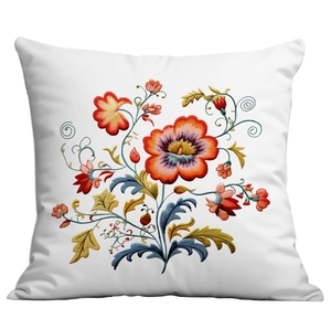 Close-up of vibrant floral embroidery textures on a white fabric throw pillow cover