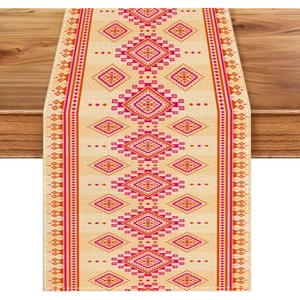 Bohemian floral table runner with geometric patterns on a rustic dark wood surface