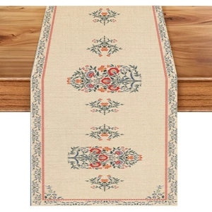 Bohemian floral table runner made of linen cotton on a rustic wooden dining table