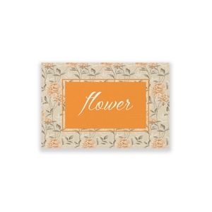 Close-up of bohemian floral table runner with orange flower text and premium stitched edges