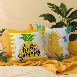 Detail view of pineapple print pillowcases featuring hello summer text and yellow stripes