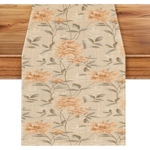 Bohemian floral table runner with orange blossoms on rustic dark wood dining table