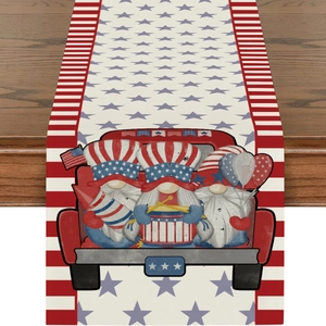 Detail of linen table runner featuring patriotic gnomes and sunflowers on wood surface