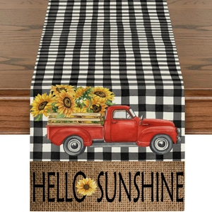 Detail of sunflower truck table runner with buffalo plaid pattern and hello sunshine text