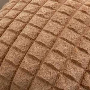 Macro detail of plush faux rabbit fur pillow cover with luxury checkered texture