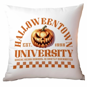Detail of Halloweentown University orange pumpkin print on white cotton linen pillowcase